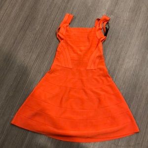 Peplum orange bandage dress.